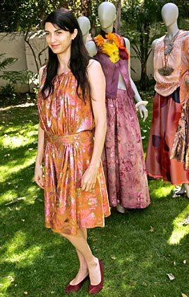 L.A. designer Gregory Parkinson showed his Fall 2008 collection in the manicured front yard of actress Shiva Roses Brentwood home. Rose, pictured here, wore a dye-treated lamé dress made for her by Parkinson.