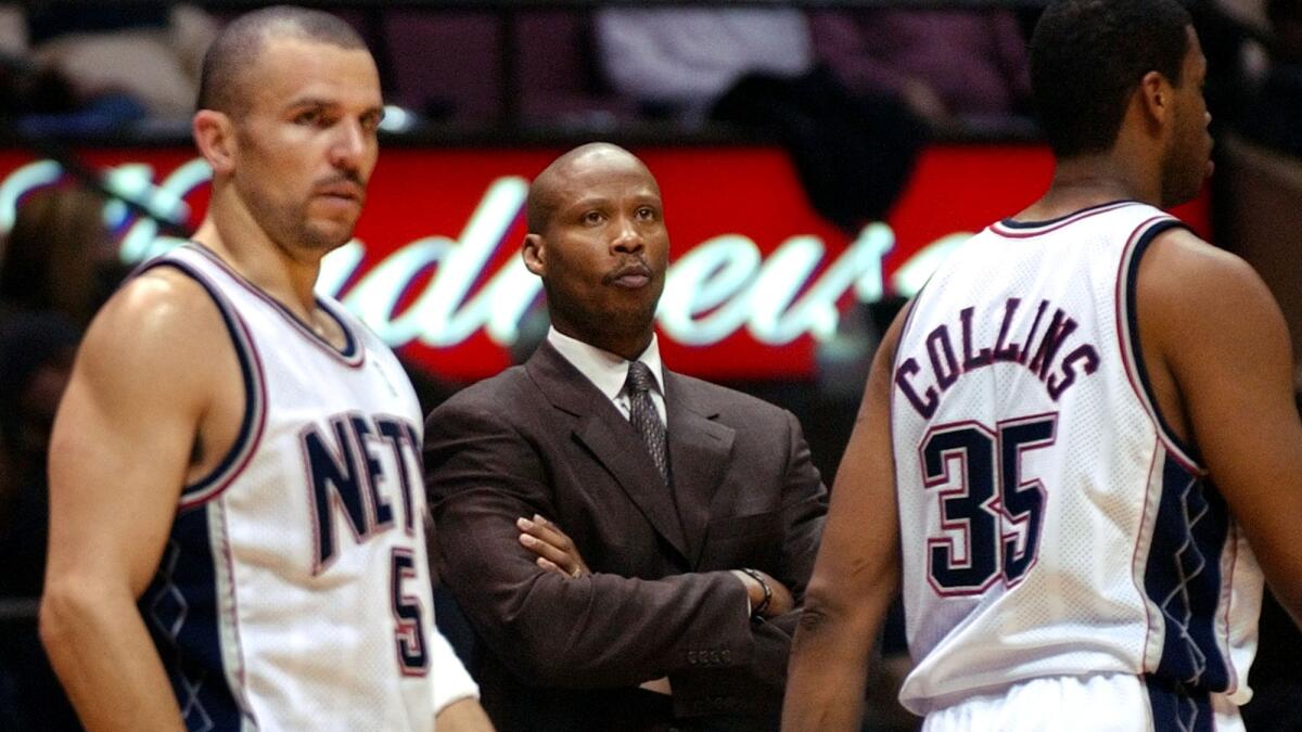 Then-New Jersey Nets Coach Byron Scott looks on as Jason Kidd, left, and Jason Collins return to the court after a timeout during a game against the Washington Wizards in December 2003. Scott now says he is on "cordial" terms with Kidd.