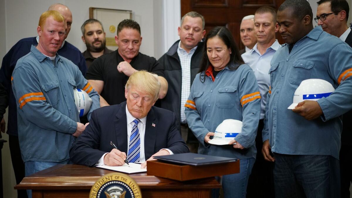 President Trump signs Section 232 Proclamations on Steel and Aluminum Imports in the Oval Office on March 8, 2018.
