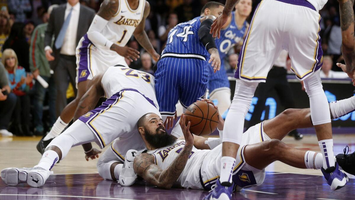Lakers center JaVale McGee comes up with a loose ball during a 108-104 loss to Orlando on Nov. 25.