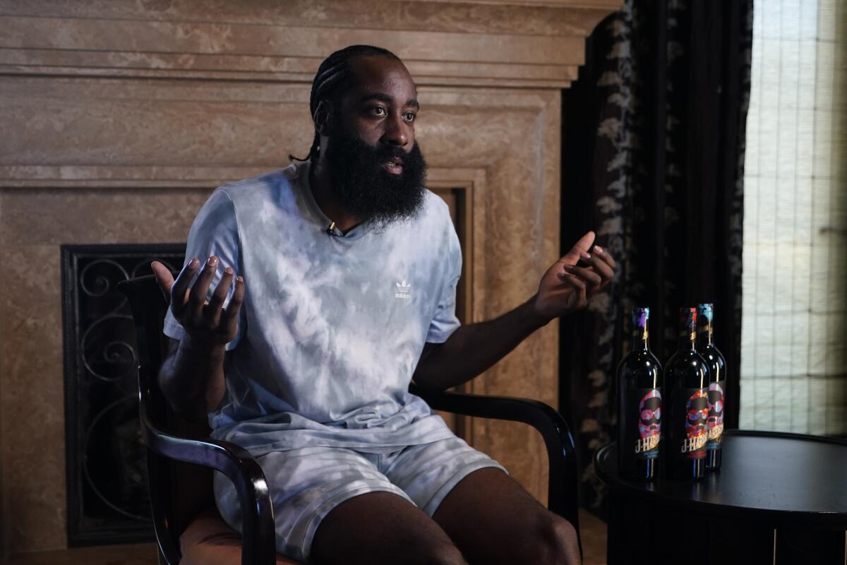 NBA 10-time All-Star James Harden discusses his upcoming J. Harden x J Shed wine collaboration that debuts in September at his home in Beverly Hills, Calif., on Sunday, July 17, 2022. (AP Photo/Damian Dovarganes)