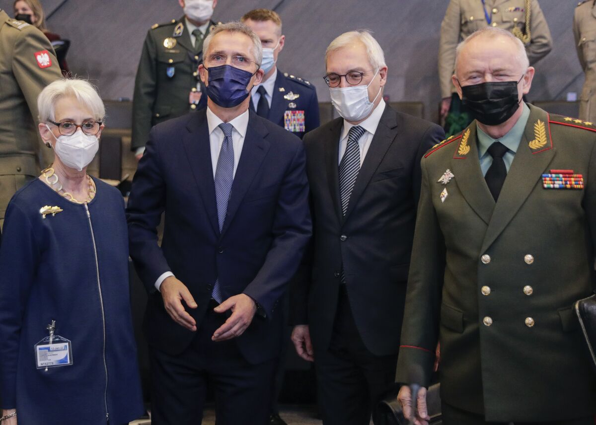 From left, United States Deputy Secretary of State Wendy Sherman, NATO Secretary General Jens Stoltenberg, Russia's Deputy Foreign Minister Alexander Grushko, and Russia's Deputy Defense Minister Alexander Fomin pose for a photo prior to the NATO-Russia Council at NATO headquarters, in Brussels, Wednesday, Jan. 12, 2022. Senior NATO and Russian officials are meeting Wednesday to try to bridge seemingly irreconcilable differences over the future of Ukraine, amid deep skepticism that Russian President Vladimir Putin's security proposals for easing tensions are genuine. (Olivier Hoslet, Pool Photo via AP)