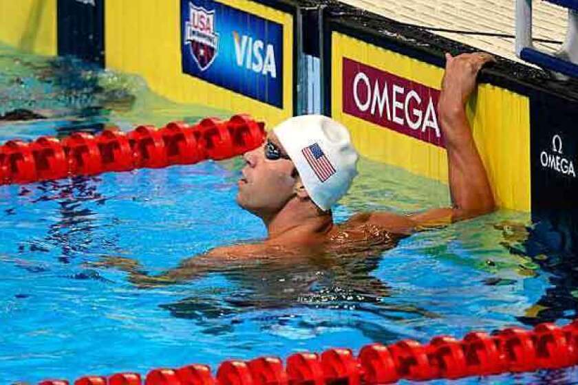 Matt Grevers checks his time after competing in a 100-meter freestyle heat on Thursday.