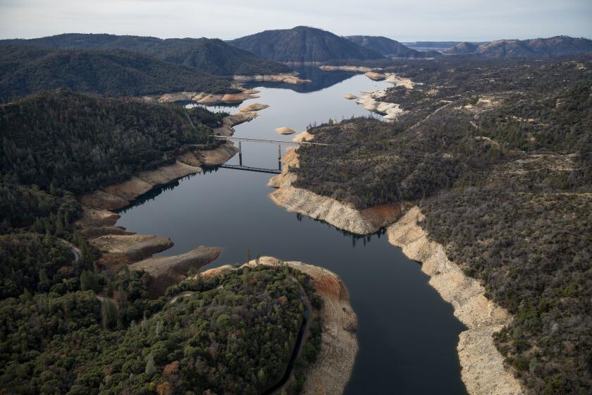 An aerial view shows low water levels at Enterprise Bridge at Lake Oroville in Butte County, California. 