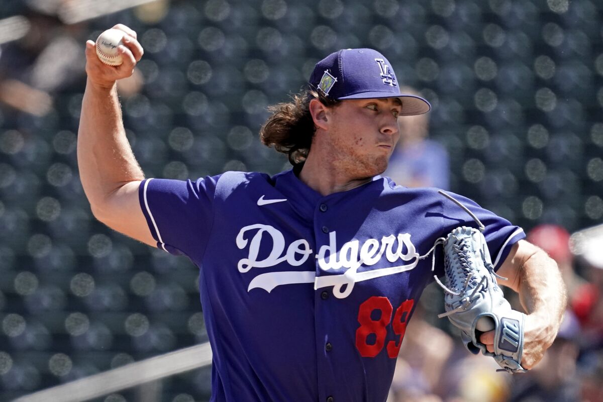 Dodgers starting pitcher Ryan Pepiot delivers against the Texas Rangers in a spring training game on March 31.