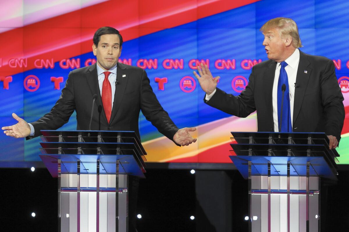 Presidential candidates Marco Rubio and Donald Trump argue while answering a question during the Republican debate held at the University of Houston on Thursday.