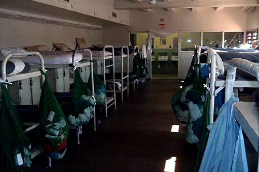 NEW POLICY: A racial integration plan is changing dormatories and cells at the Sierra Conservation Center, a prison in Tuolumne County, which is dropping its unwritten rule of pairing inmates of the same race in the same bunk.