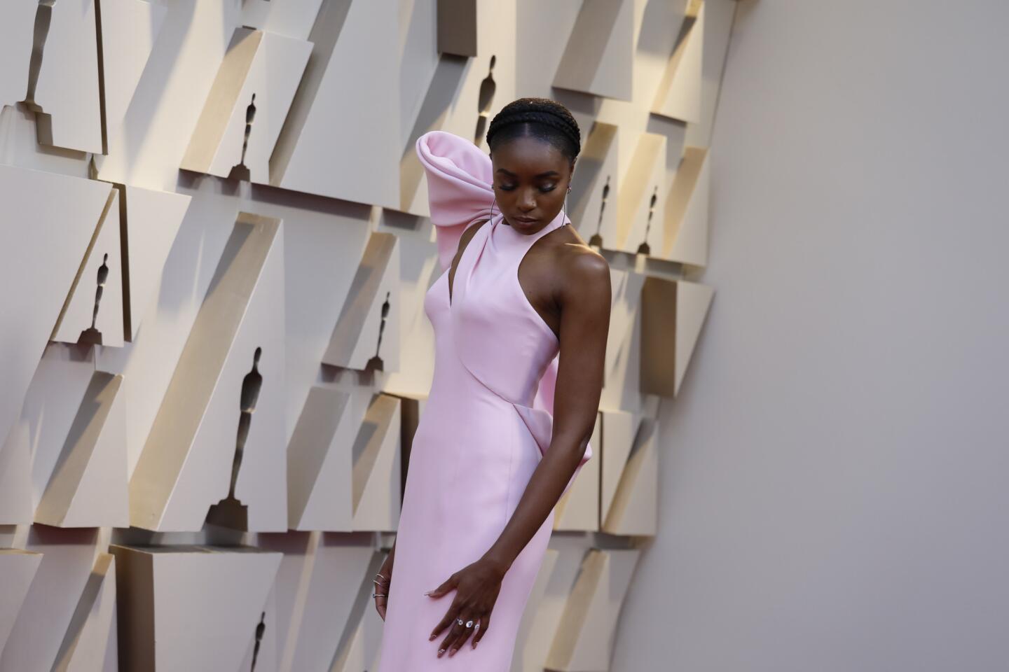 HIT: KiKi Layne is a vision in pink Atelier Versace (one of Sunday's go-to hues) with a giant shoulder embellishment.