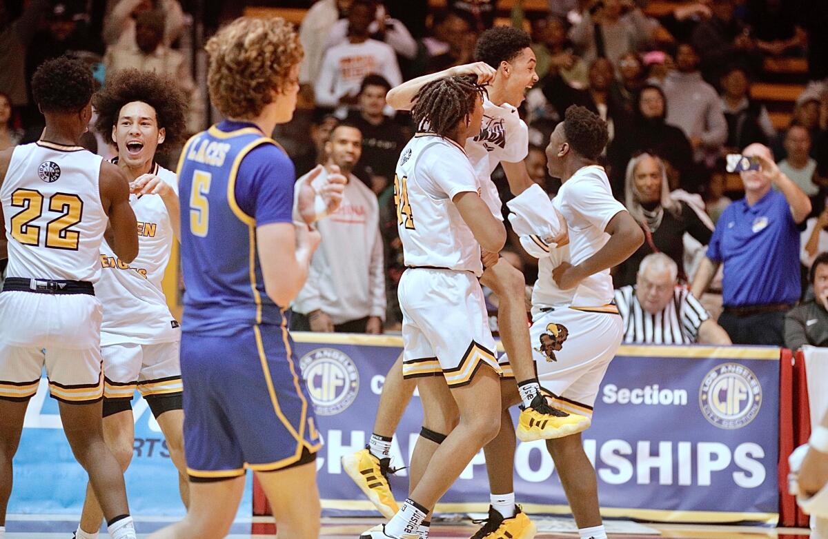 King/Drew players celebrate their Open Division victory over LACES on Saturday.