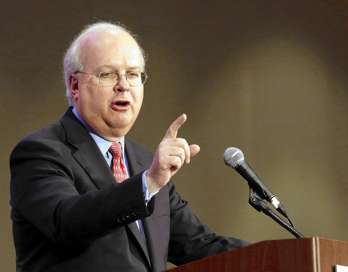 Republican strategist Karl Rove became known for pioneering a new type of campaign spending, but his two funding groups have stepped out of the GOP spotlight in this year's election campaigns.
