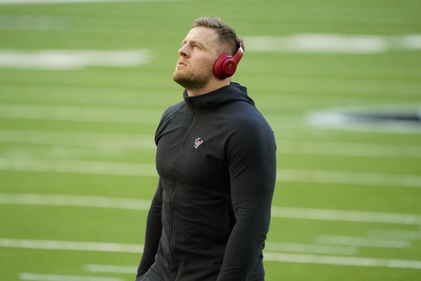 Houston Texans defensive end J.J. Watt warms up on the field before a game.