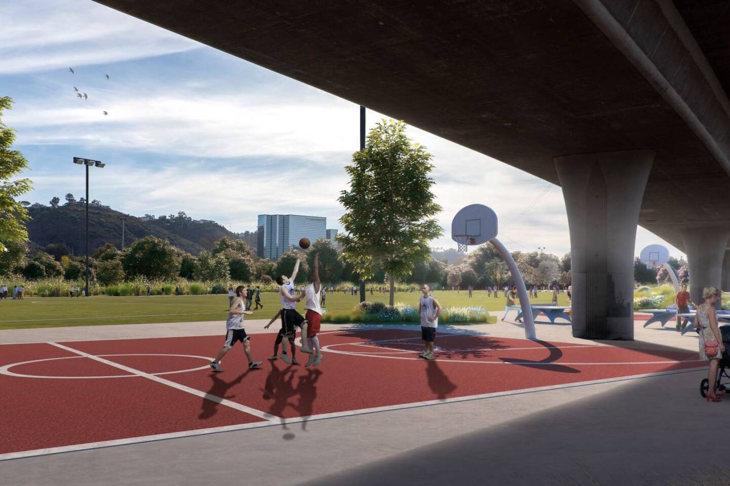 A rendering of the future activity zone, which includes a half- and full-sized basketball court, pingpong tables and picnic tables. Two of the project's six recreational fields are pictured in the background.
