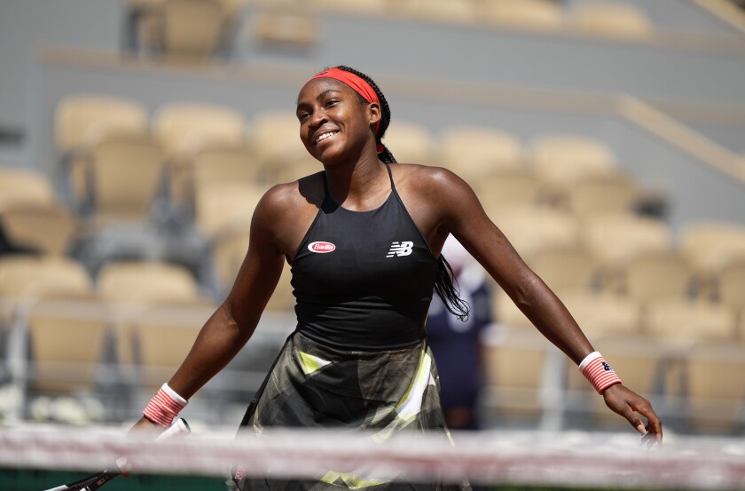 United States's Coco Gauff celebrates after defeating Tunisia's Ons Jabeur during their fourth round match on day 9, of the French Open tennis tournament at Roland Garros in Paris, France, Monday, June 7, 2021. (AP Photo/Michel Euler)
