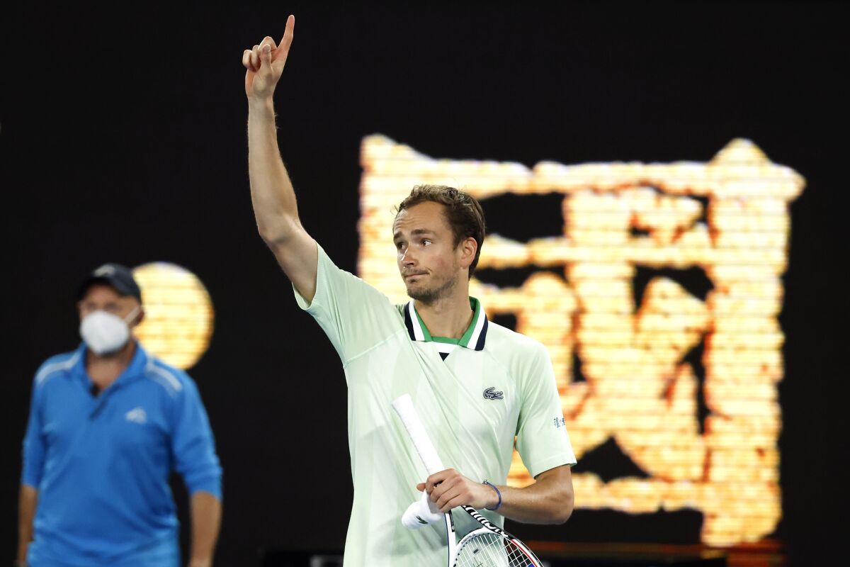 Daniil Medvedev of Russia gestures after defeating Nick Kyrgios of Australia in their second round match at the Australian Open tennis championships in Melbourne, Australia, Thursday, Jan. 20, 2022. (AP Photo/Hamish Blair)