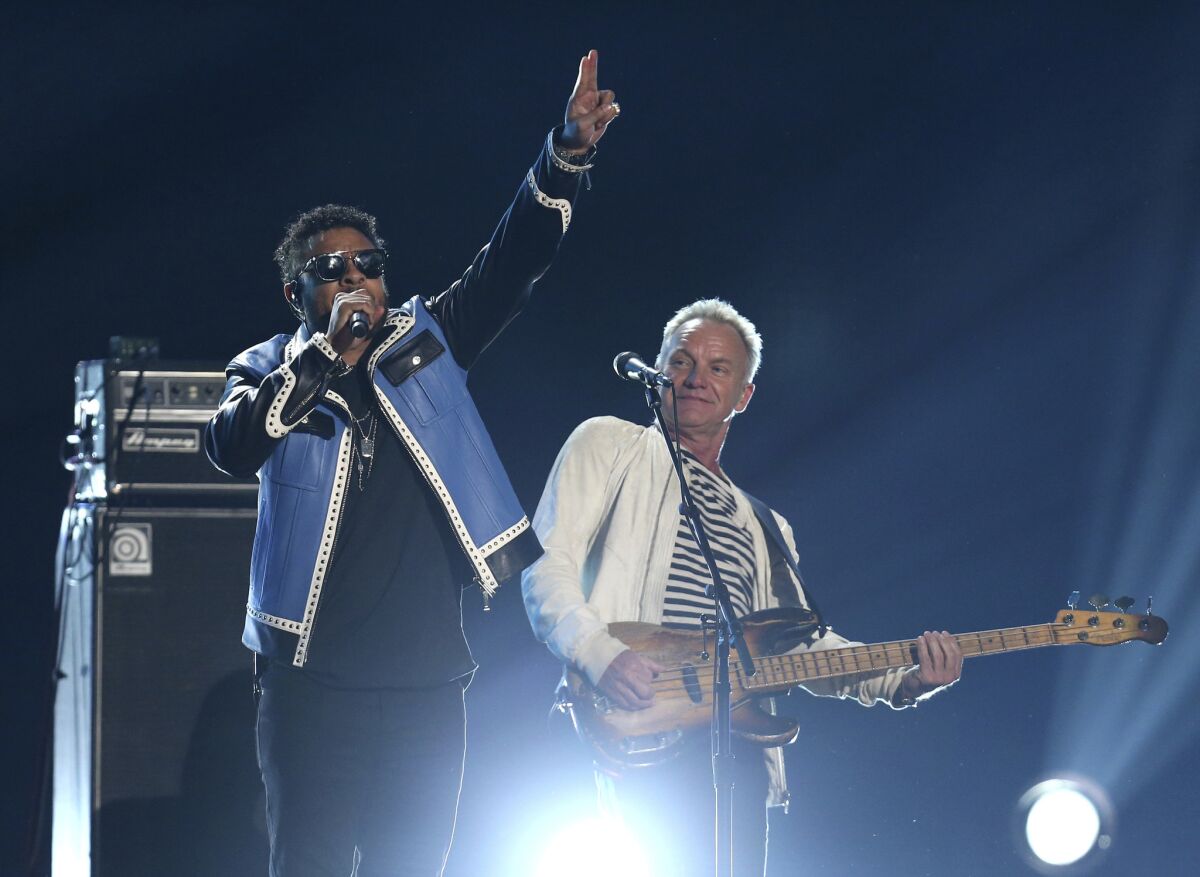 Shaggy, left, and Sting perform "Englishman in New York" at the 60th Grammy Awards.