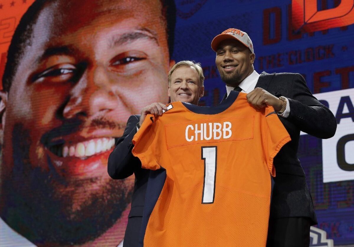 North Carolina State's Bradley Chubb poses with Commissioner Roger Goodell after Chubb was selected No. 5 by the Denver Broncos.