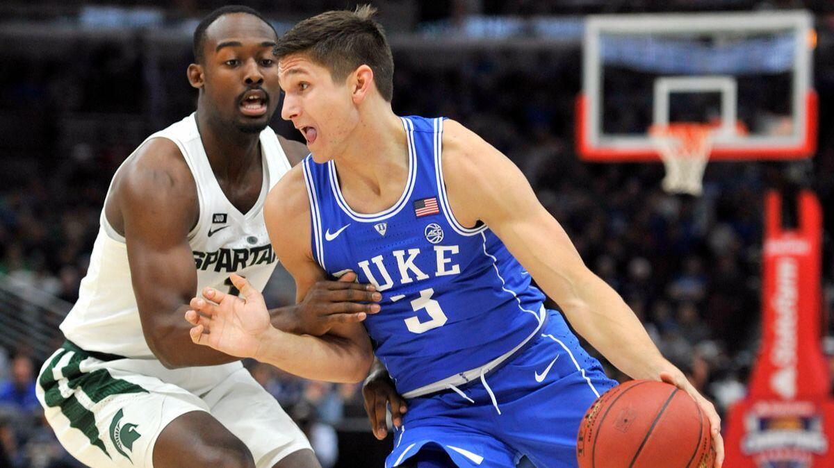 Duke guard Grayson Allen (3) drives on Michigan State guard Joshua Langford during the first half on Tuesday in Chicago.