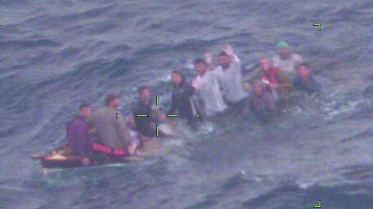 This image made available by the the U.S. Coast Guard shows Cuban migrants on a sinking vessel spotted on Thursday, Feb. 3, 2022, about 40 miles off Key Largo, Fla. “They didn’t have lifejackets or safety equipment,” said Capt. Shawn Koch, commanding officer of Air Station Miami. “If the air crew hadn’t found them on the patrol, these people would not have survived the night.” The migrants were repatriated to Cuba, the Coast Guard said. (U.S. Coast Guard via AP)