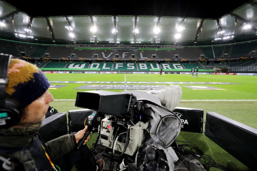 WOLFSBURG, GERMANY - MARCH 12: (FREE FOR EDITORIAL USE) In this handout image provided by VfL Wolfsburg, A TV cameraman prepares for the match prior to the UEFA Europa League round of 16 first leg match between VfL Wolfsburg and Shakhtar Donetsk at Volkswagen Arena on March 12, 2020 in Wolfsburg, Germany. The match was played behind closed doors as a precaution against the spread of COVID-19 (Coronavirus). (Photo by Handout/VfL Wolfsburg via Getty Images)