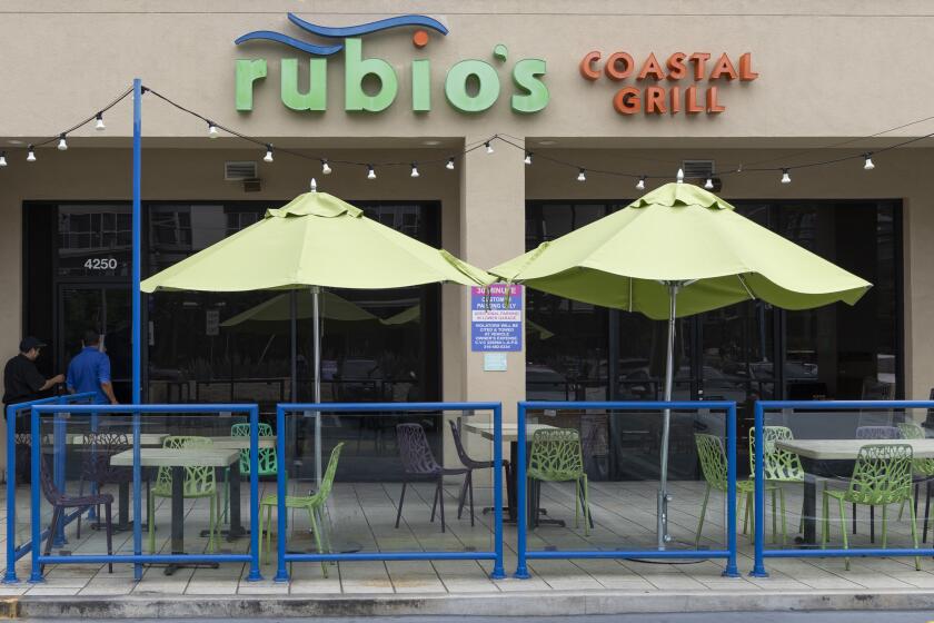 Los Angeles, CA - June 03: Passerby's look in the windows of Rubio's Costal Grill on Lincoln Blvd in Los Angeles, CA. (Zoe Cranfill / Los Angeles Times)