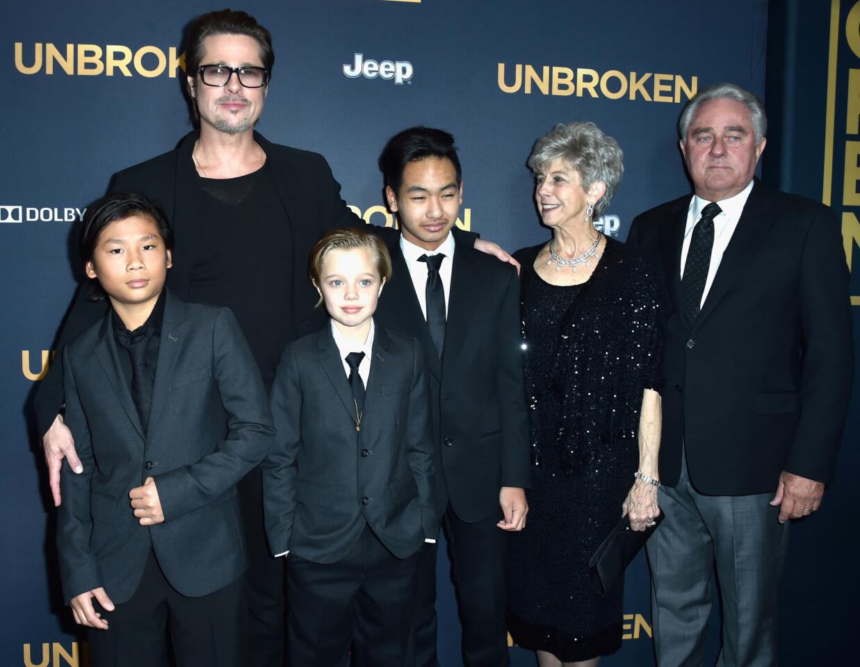 "Unbroken" director Angelina Jolie's husband Brad Pitt, kids Pax, Shiloh and Maddox and Pitt's parents, Jane and William Pitt, attend the Hollywood premiere of the film while Jolie deals with chicken pox.