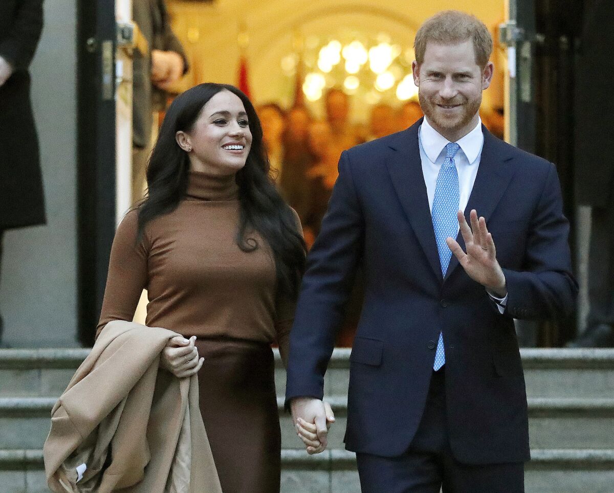 FILE - In this Jan. 7, 2020, file photo, Britain's Prince Harry and Meghan, Duchess of Sussex leave Canada House in London. Six months after detangling their work lives from the British royal family, the couple have signed a multiyear deal with Netflix. According to a statement Wednesday, they plan to produce nature series, documentaries and children’s programming through a new production company. The two recently relocated to Santa Barbara, California, with baby Archie. (AP Photo/Frank Augstein, File)