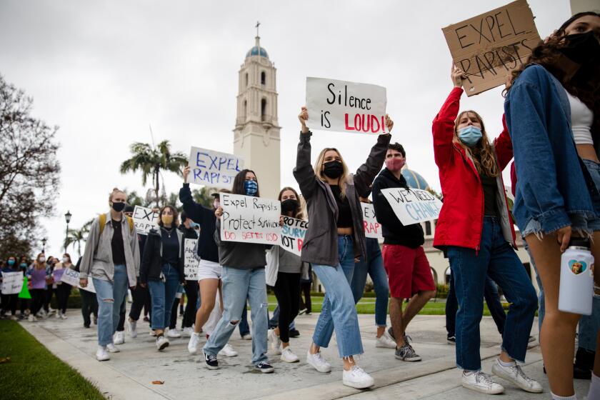 People march on University of San Diego’s campus to protest against the school’s decision to allow a student accused of sexual assault to return after a one-semester ban on Sunday, May 16, 2021.
