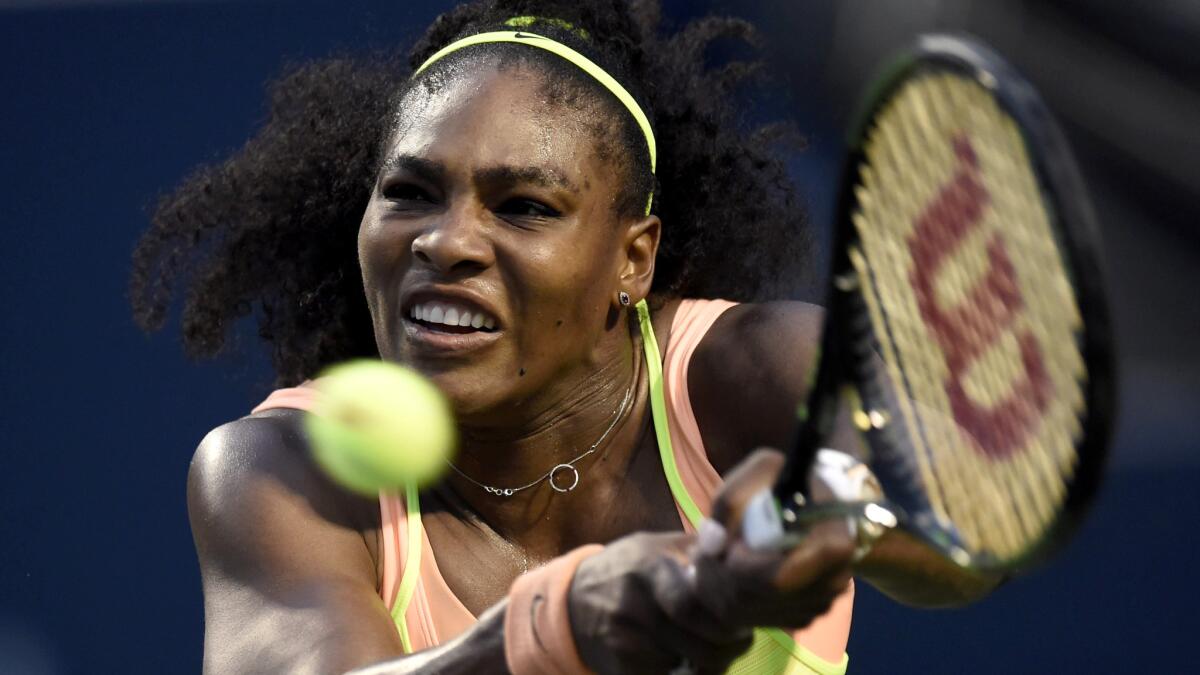 Serena Williams returns a shot against Roberta Vinci during a quarterfinal match at the Rogers Cup in Toronto.
