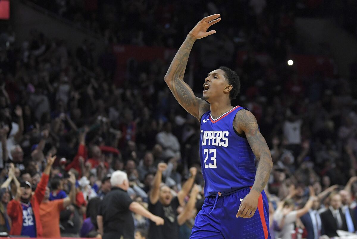 Clippers guard Lou Williams celebrates after scoring late in a game against the Wizards.