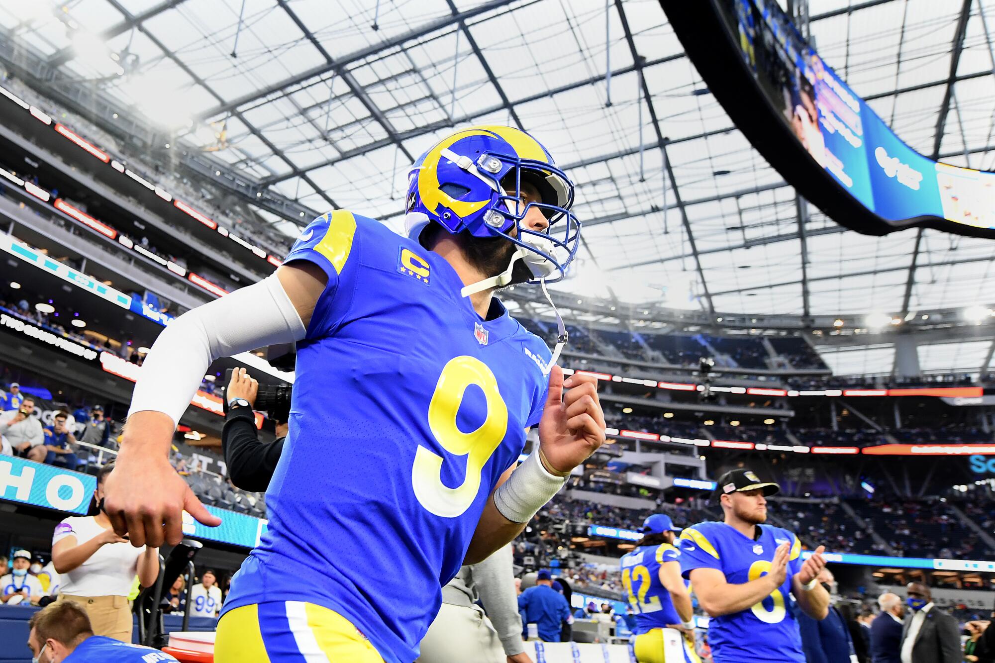 Rams quarterback Matthew Stafford takes the field before a wild-card playoff game.