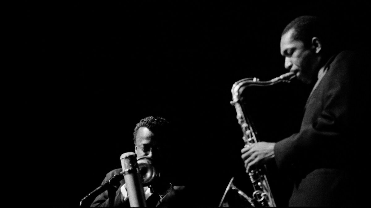 Miles Davis, left, is shown with John Coltrane at a 1960 concert in Paris. 