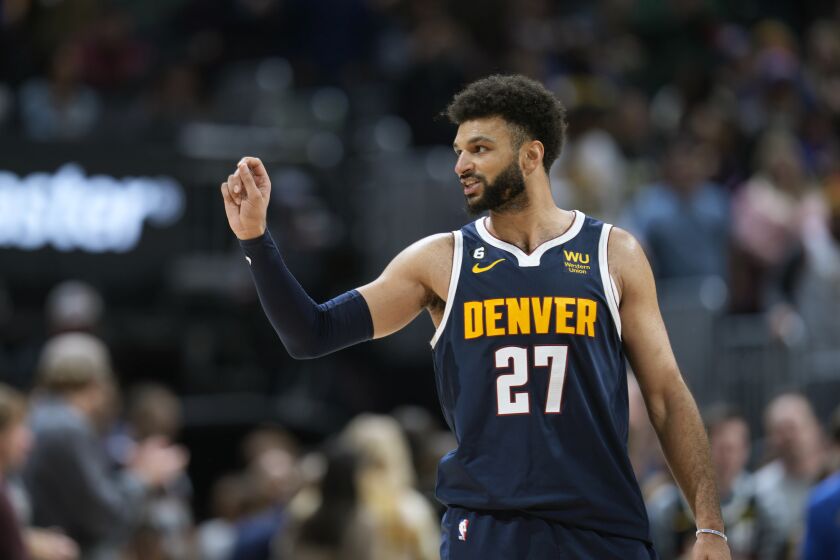 Denver Nuggets guard Jamal Murray gestures to the crowd as time runs out in the second half of an NBA basketball game against the New Orleans Pelicans Tuesday, Jan. 31, 2023, in Denver. (AP Photo/David Zalubowski)