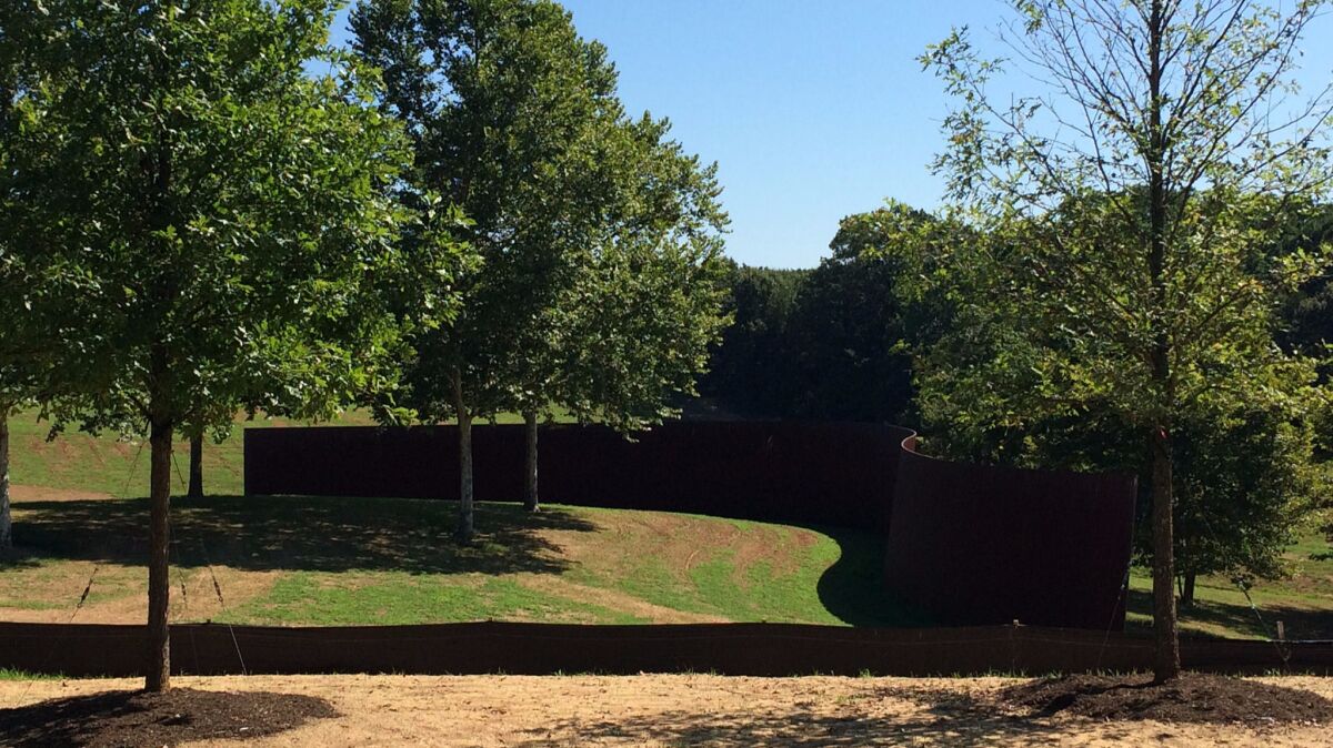 In the distance, "Contour 290," by Richard Serra.