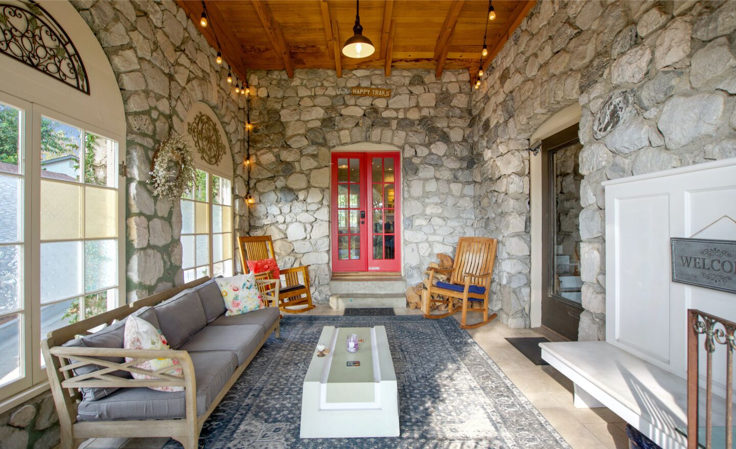 Built in 1936 from locally quarried stone, the charming stone-clad home holds four bedrooms and five bathrooms in 2,800 square feet.