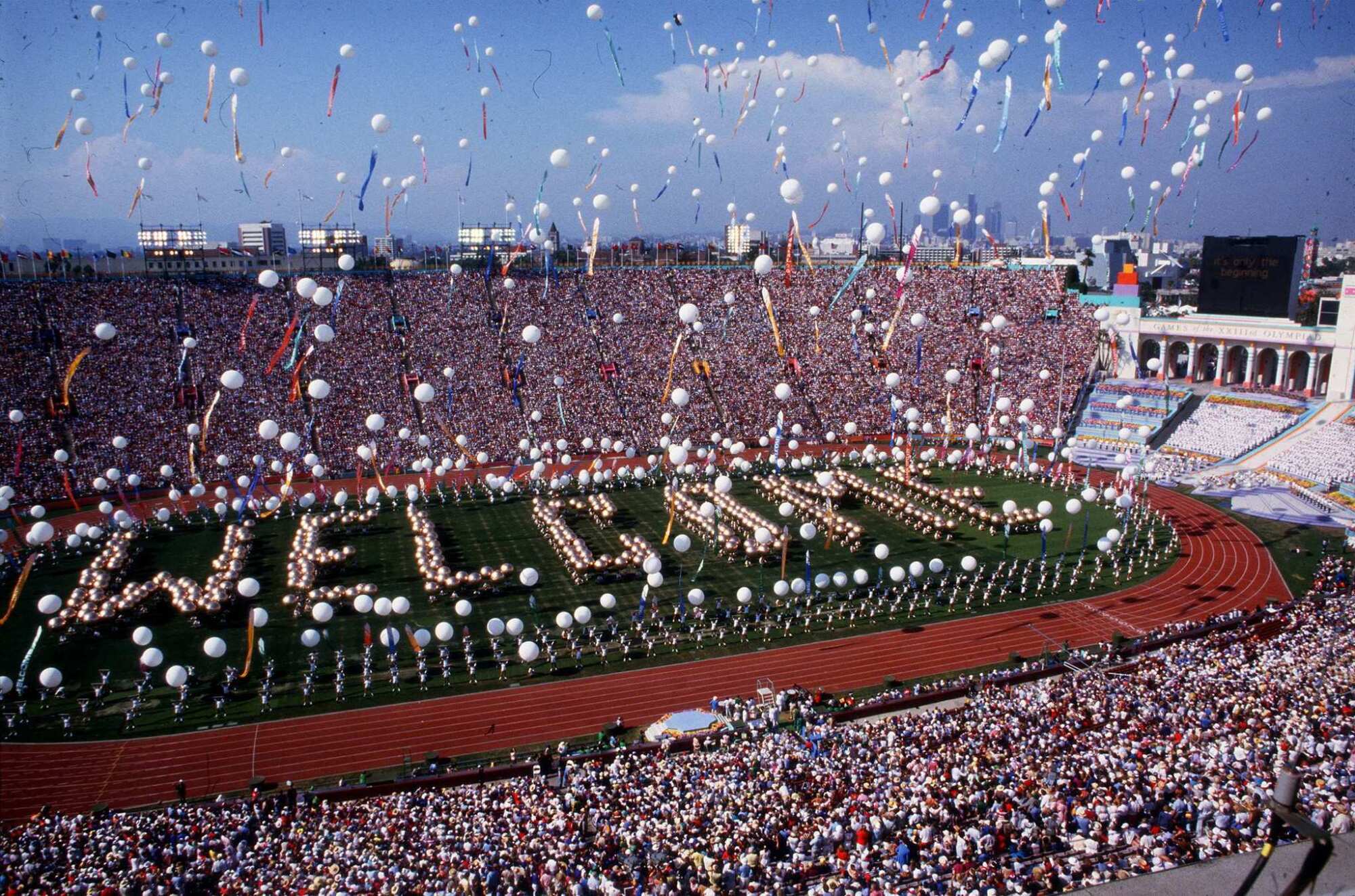 Balloons are released during a festive opening ceremony for the 1984 Olympics at the Memorial Coliseum.
