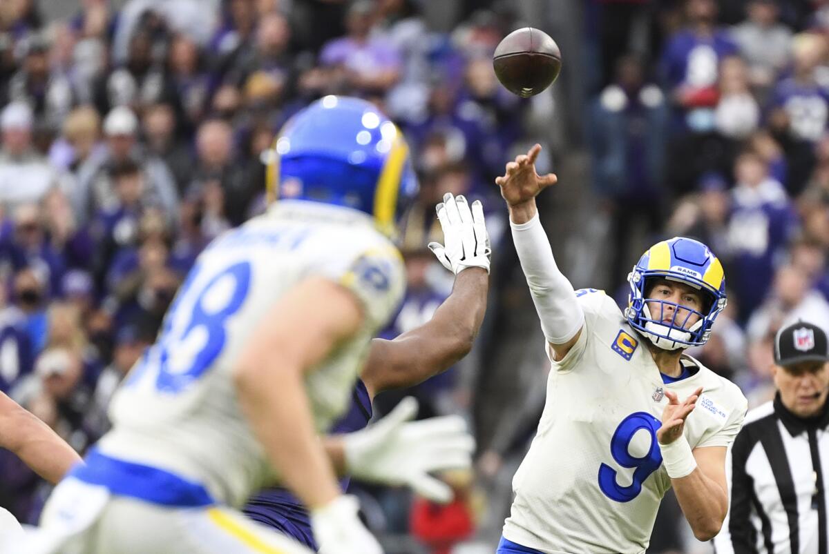 Rams quarterback Matthew Stafford (9) passes the ball to wide receiver Ben Skowronek (18).