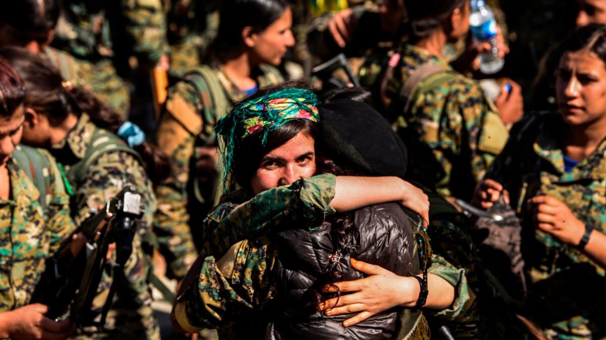 Female fighters of the Syrian Democratic Forces gather during an Oct. 19 celebration in Raqqah, after retaking the city from Islamic State militants.