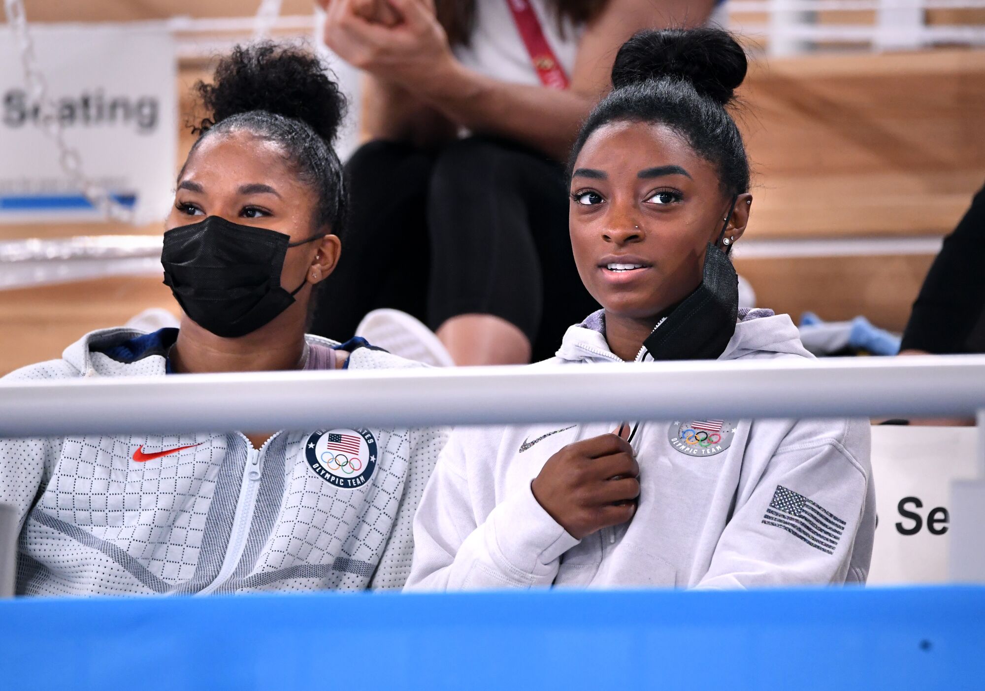 Simone Biles and Jordan Chiles watch the women's individual all-around final.