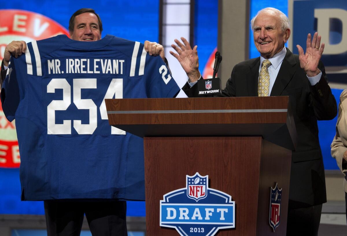 Former USC and Baltimore Colts receiver Paul Salata takes to the podium to announce "Mr. Irrelevant," the 254th and final pick of the 2013 NFL draft on Saturday in New York.