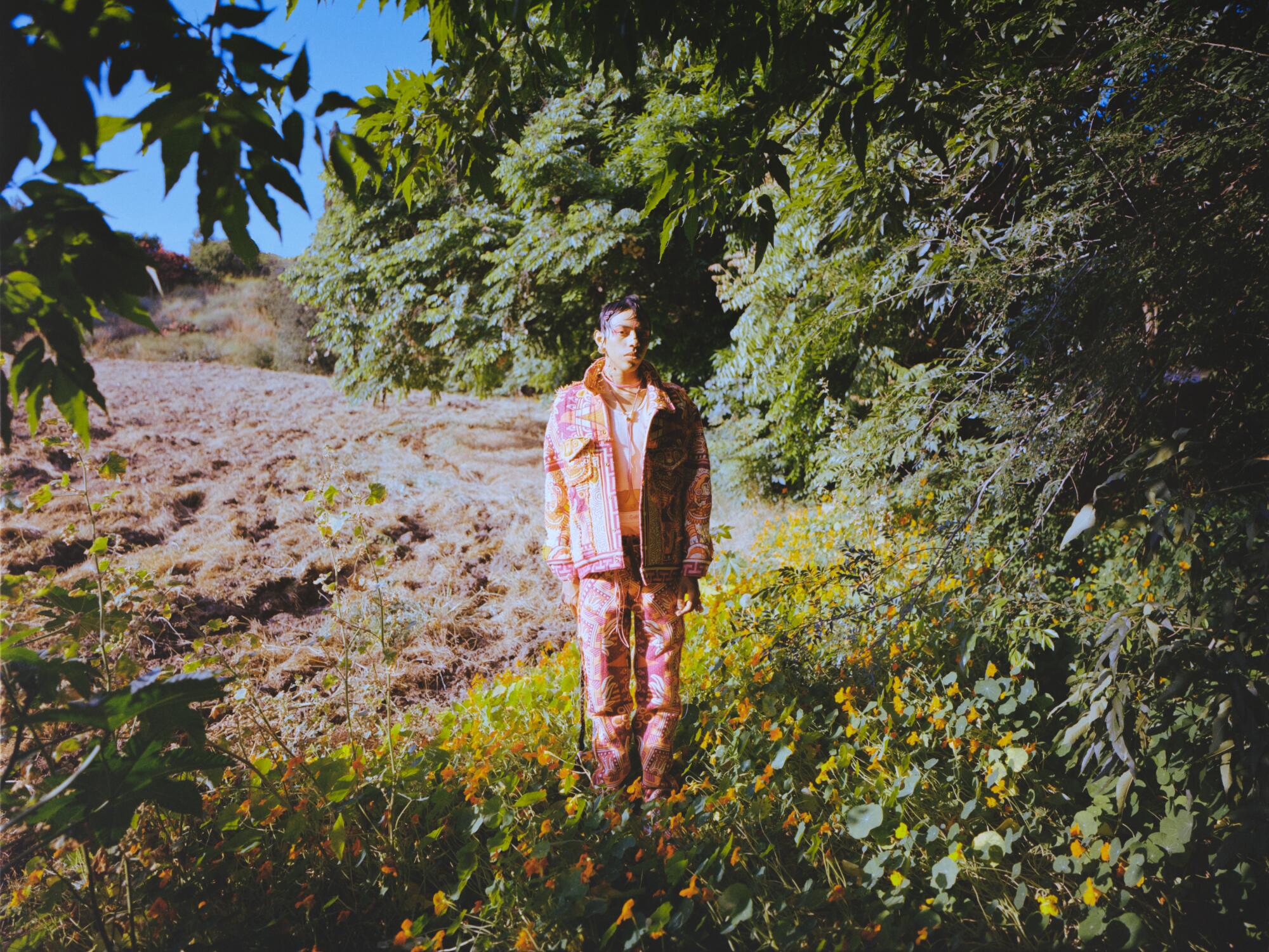 Jesus Garcia wears Equihua Origins jacket and pants in Bougainvillea Pink.