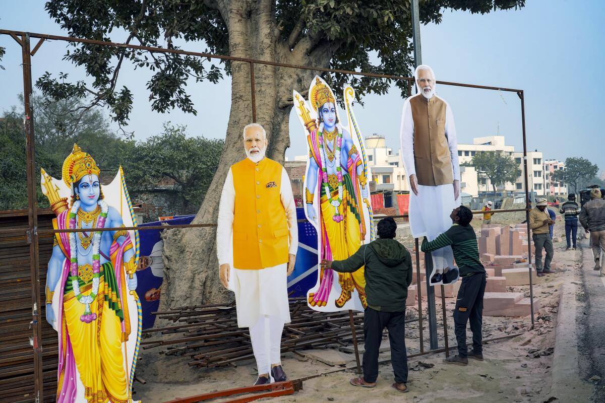 Cardboard cutouts of Hindu deity Lord Ram and Prime Minister Narendra Modi.