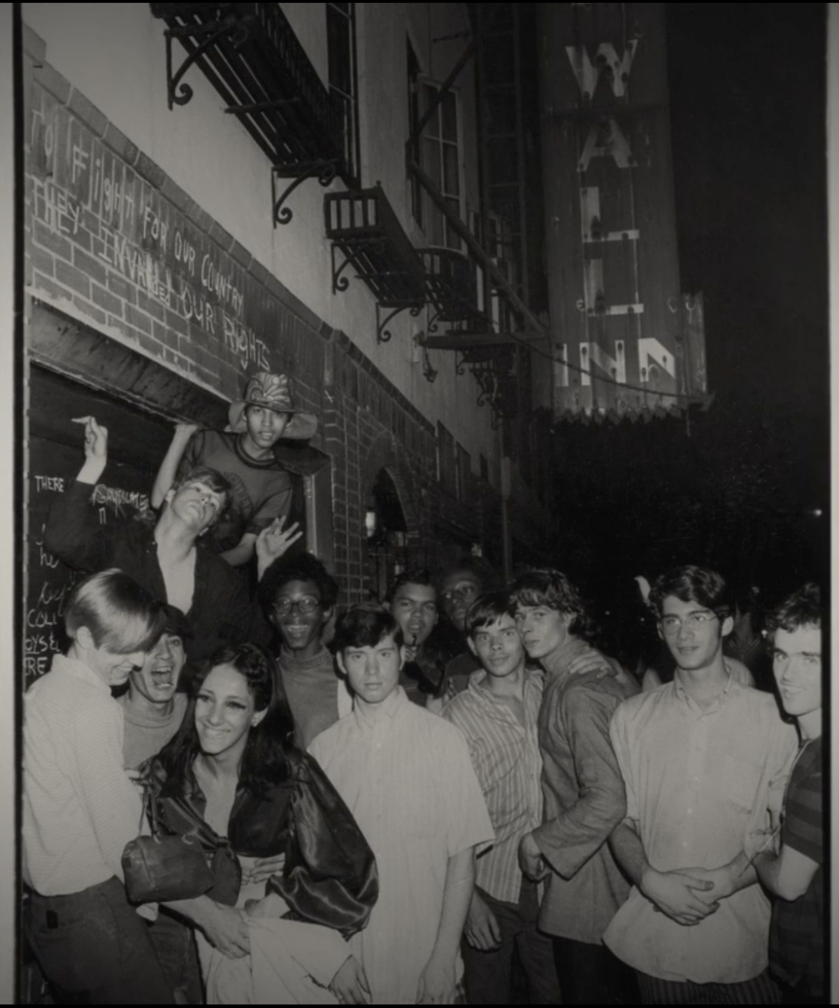 An archival photograph of a group of people outside the Stonewall Inn