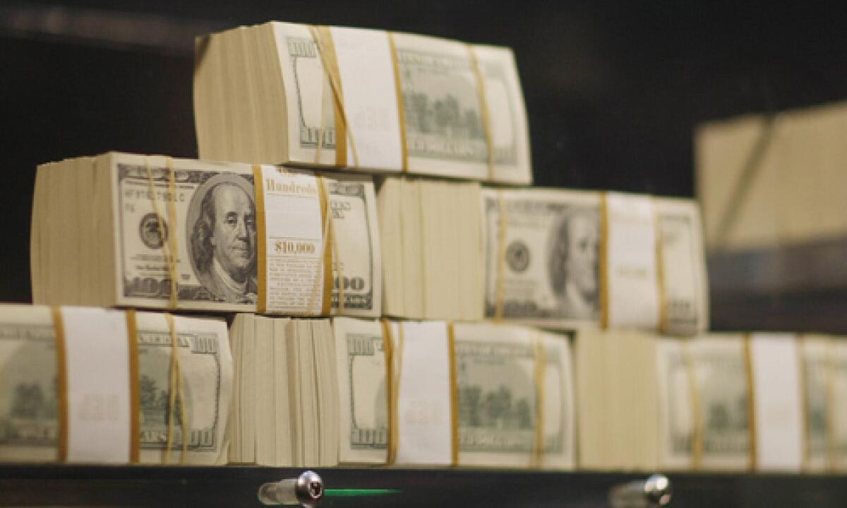 Stacks of money in an exhibit of five million dollars in cash at a casino in Florida.