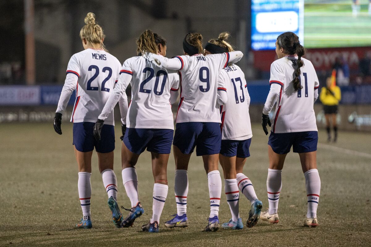 United States' Kristie Mewis (22), Catarina Macario (20), Mallory Pugh (9), Ashley Sanchez (13) and Sophia Smith (11) celebrate a goal by Macario during the first half of a SheBelieves Cup soccer match against Iceland, Wednesday, Feb. 23, 2022, in Frisco, Texas. The United States won 5-0. (AP Photo/Jeffrey McWhorter)