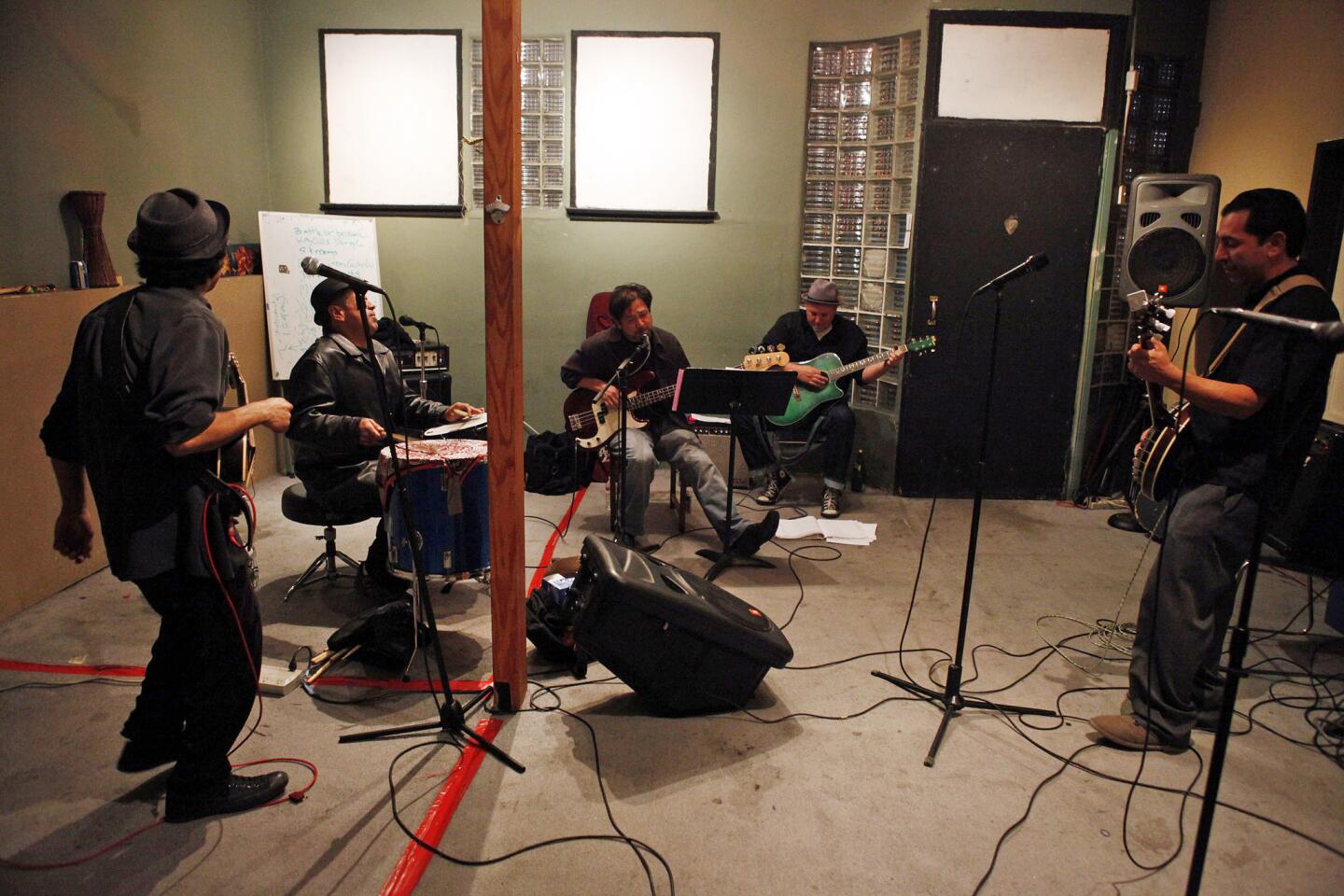 Members of the L.A. Chicano band Ollin rehearse for a St. Patrick's Day gig playing the music of their Anglo Irish brothers in song the Pogues. Ollin will cover the Pogues' "Rum, Sodomy and the Lash" Sunday at the Satellite in Silver Lake.