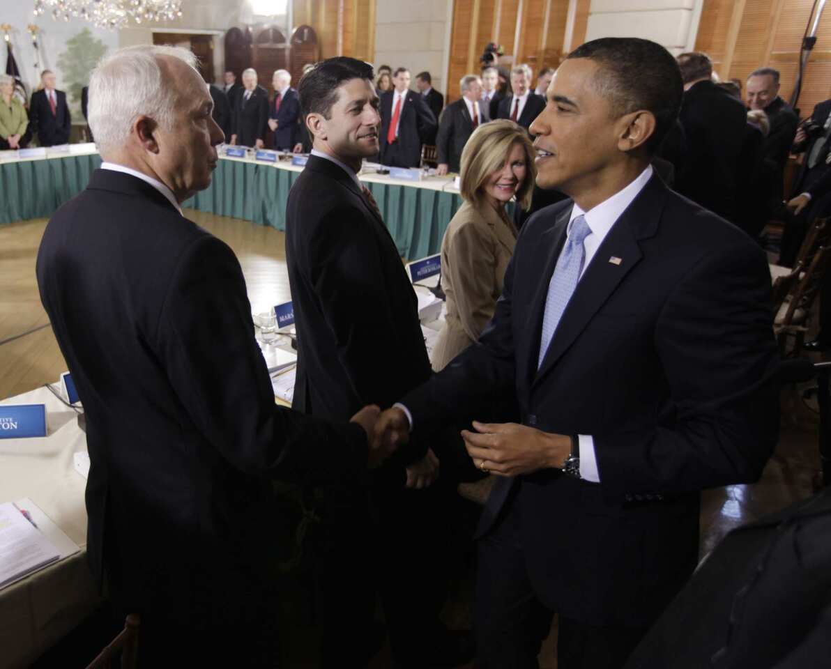 President Obama, right, shakes hands with Rep. John Kline (R-Minn.) at the Blair House in Washington prior to the start of the healthcare summit. From left are Kline, Rep. Paul Ryan (R-Wisc.), Rep. Marsha Blackburn (R-Tenn.) and the president.