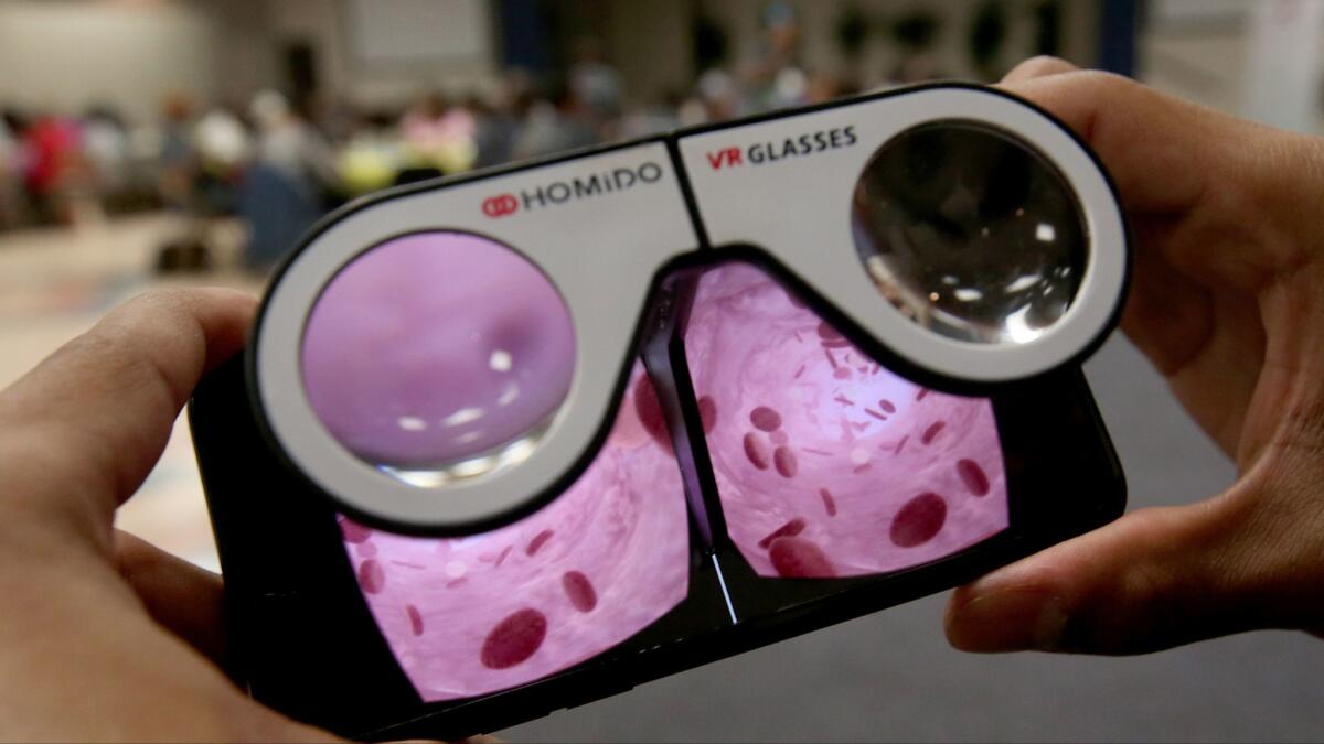 A virtual reality video on a mobile phone that focuses on different foods and their sodium content. (Luis Sinco / Los Angeles Times)