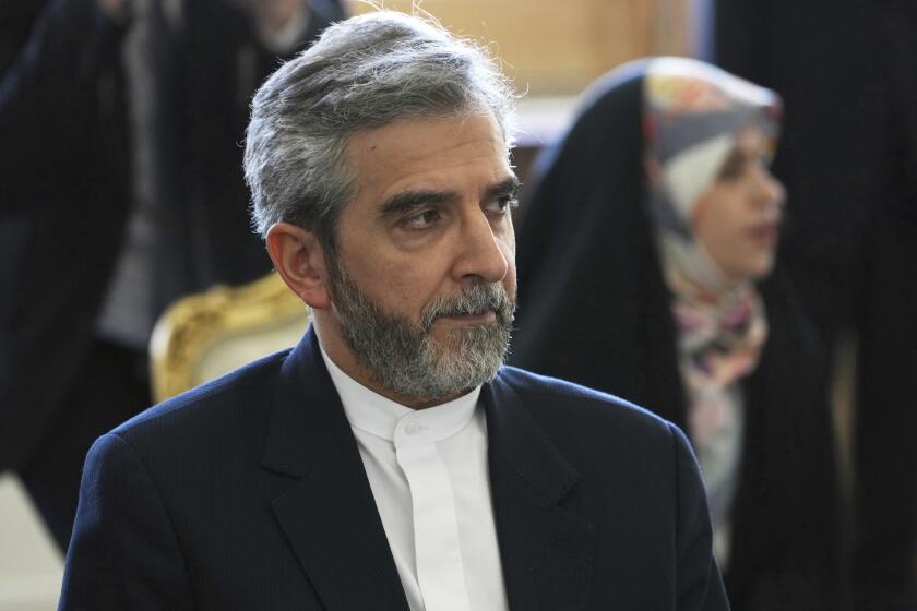 FILE - Iran's top nuclear negotiator Ali Bagheri Kani listens to Russian Foreign Minister Sergey Lavrov during a meeting in Tehran, Iran, June 23, 2022. Iran and the United States appear poised to start indirect talks in Qatar aimed at finding a way to save Tehran’s tattered nuclear deal with world powers. The state-owned Tehran Times posted a photograph on Tuesday, June 28, 2022, of Kani, in a hotel lobby with Iranian Ambassador to Qatar Hamidreza Dehghani. (AP Photo/Vahid Salemi, File)