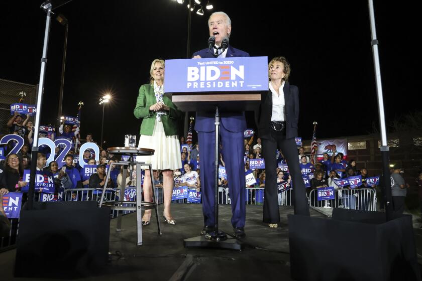 LOS ANGELES, CA, TUESDAY, MARCH 3, 2020 - Democratic Presidential hopeful Joe Biden enters the stage with his wife, Jill and sister, Valerie, right, at the Baldwin Hills Recreation Center. (Robert Gauthier/Los Angeles Times)