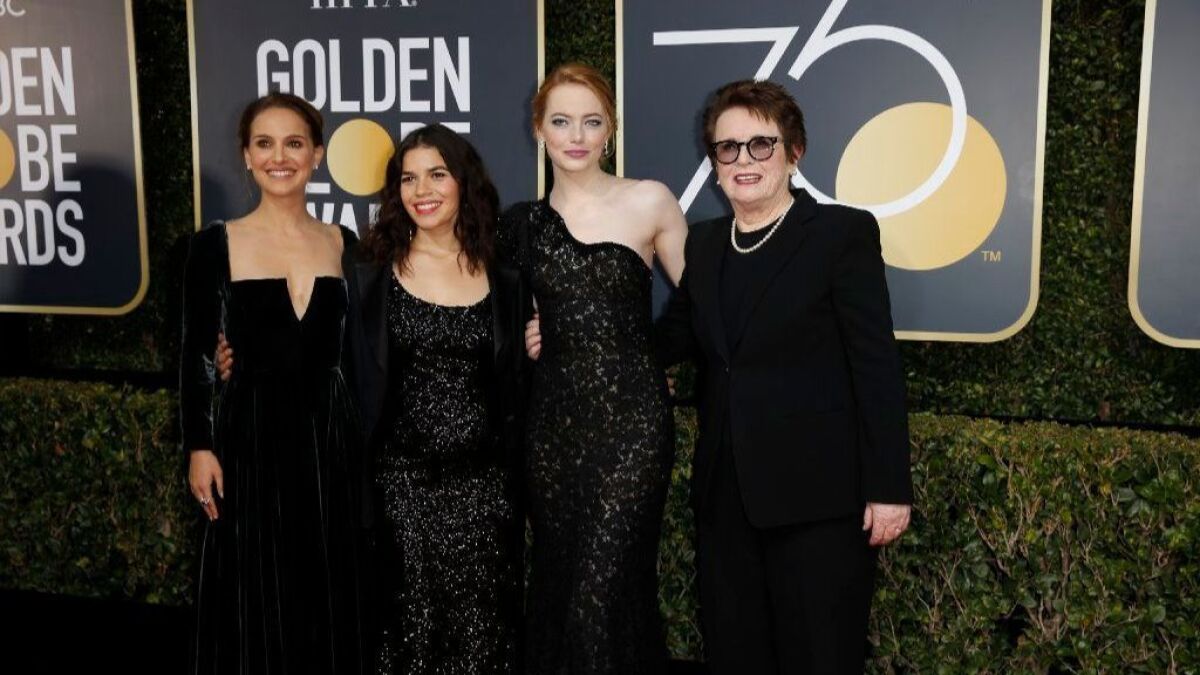 Actresses Natalie Portman, America Ferrera and Emma Stone and former tennis player Billie Jean King arrive dressed in black at the 75th Golden Globes at the Beverly Hilton Hotel on Jan. 7.
